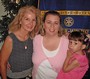 Cherie Schroeder (Foster & Kinship Care Education Specialist/Director)and Hiedi Andersen (former Foster Youth and now Foster and Adoptive Parent), holding Lily Andersen, who was placed into foster care at birth and adopted by loving foster parents, Ed and Hiedi Andersen.
